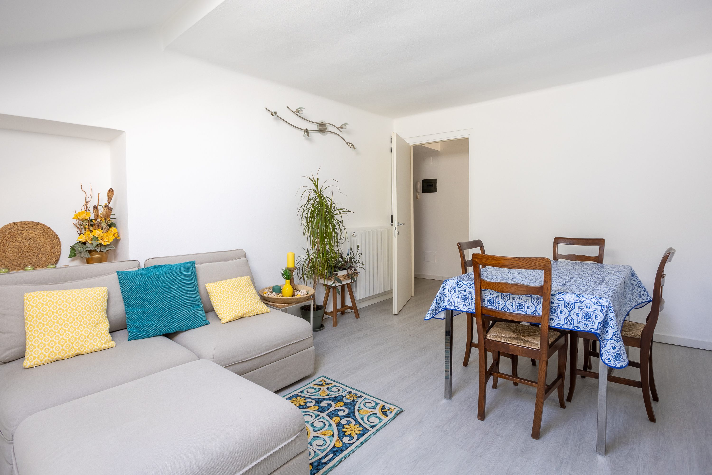 Living room with a sofa and dining table
